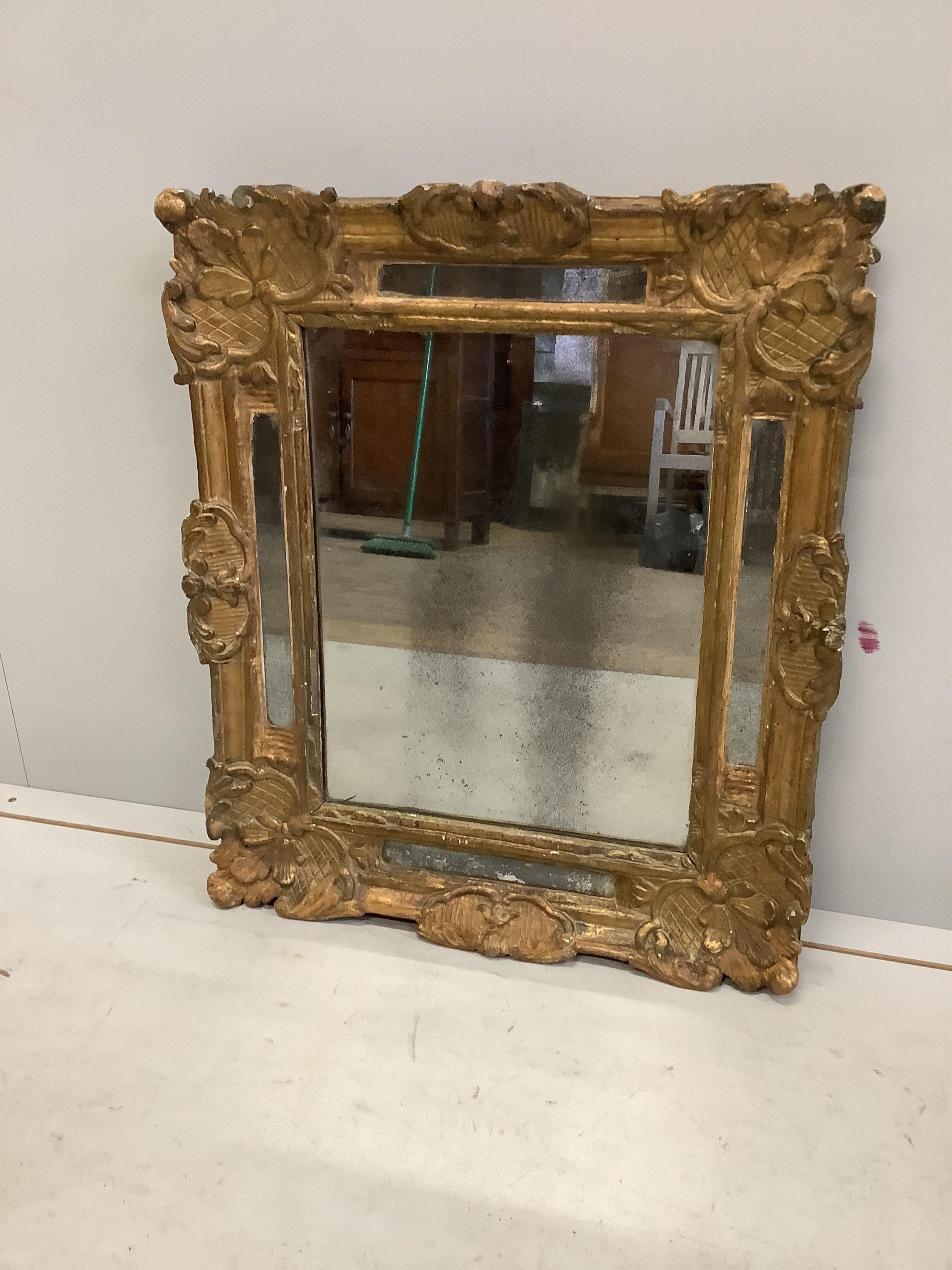 An early 19th century rectangular gilt composition marginal plate wall mirror, width 50cm, height 59cm. Condition - fair